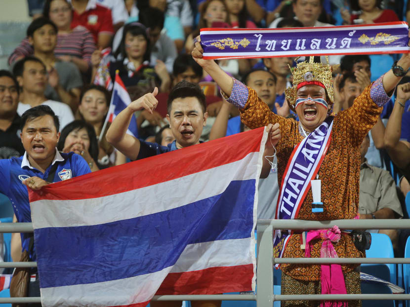 Thai supporters cheering for their side during a game against Laos at the Bishan Stadium. Photo: Don Wong