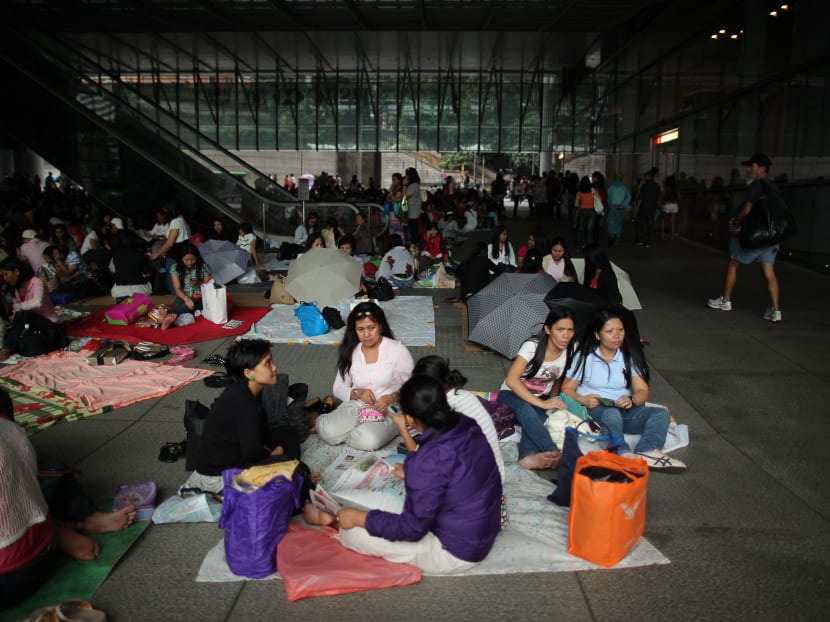Foreign domestic helpers gathering beneath the HSBC building in Hong Kong's Central district. Photo: AFP