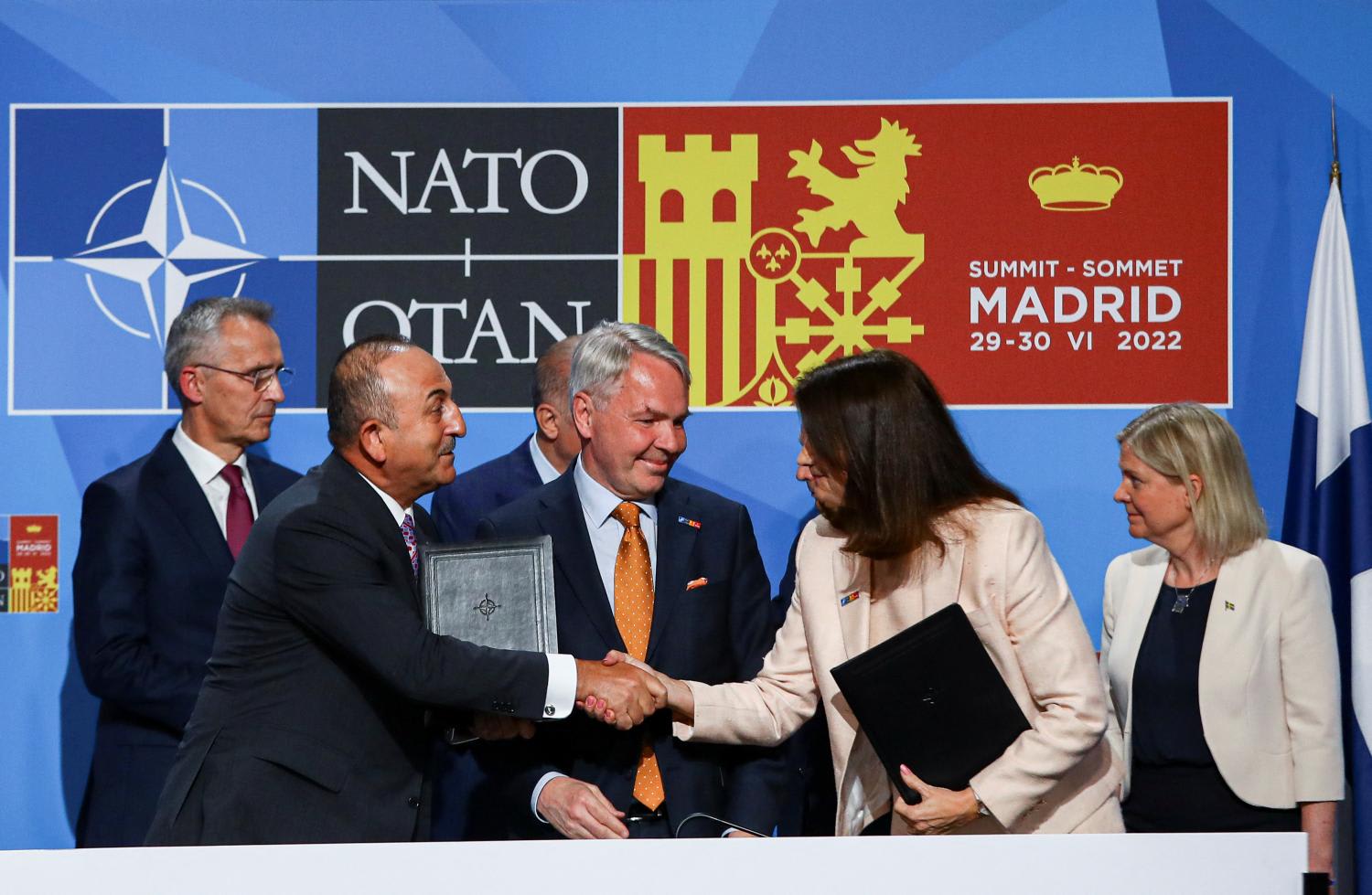 Turkish Foreign Minister Mevlut Cavusoglu shakes hands with Sweden's Foreign Minister Ann Linde after signing a document during the Nato summit in Madrid, Spain, on June 28, 2022. Turkish Foreign Minister Mevlut Cavusoglu shakes hands with Sweden's Foreign Minister Ann Linde after signing a document during the Nato summit in Madrid, Spain, on June 28, 2022.