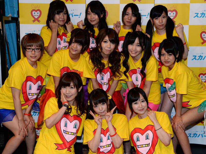Nine Japanese porn actresses, (middle L-R) Kotone Nishida, Iku Sakuragi, Rina Serino, Yui Kasugano and Nodoka Otsuka, (rear L-R) Yuria Kitahara, Riku Nekota, Yumena Muro and Karin Natsumi, pose with three supporters (front) in Tokyo on August 30, 2014, as they were preparing to have their breasts squeezed by fans for 24 hours this weekend for a charity event loosely translated as "Boob Aid". AFP file photo