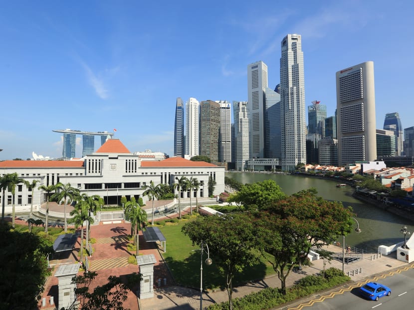 A view of Parliament House against the backdrop of the Central Business District in Singapore.