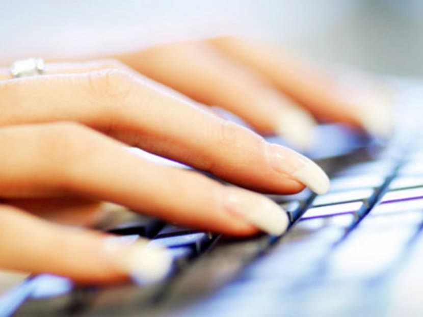 Hands type on a keyboard. Photo: Reuters