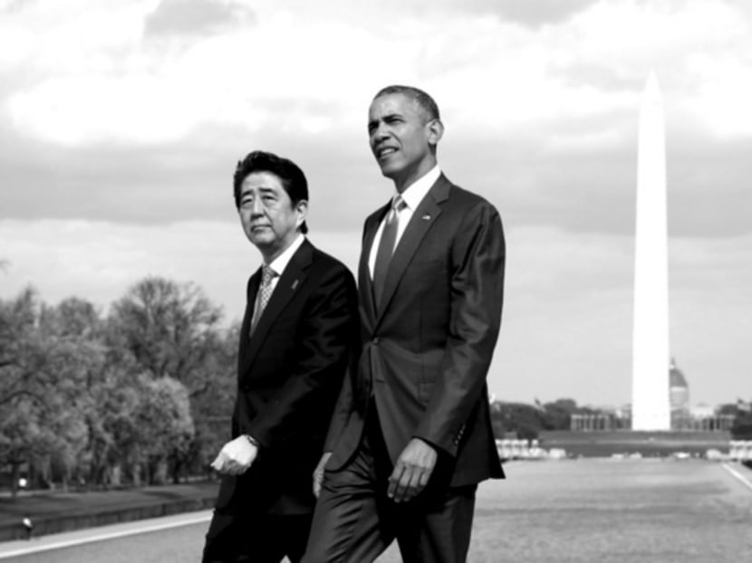 Mr Abe (left) meeting Mr Obama last month in Washington to wrap up talks on the Trans-Pacific Partnership. Japan still has high barriers to imports of goods because of agricultural protection. Photo: Reuters