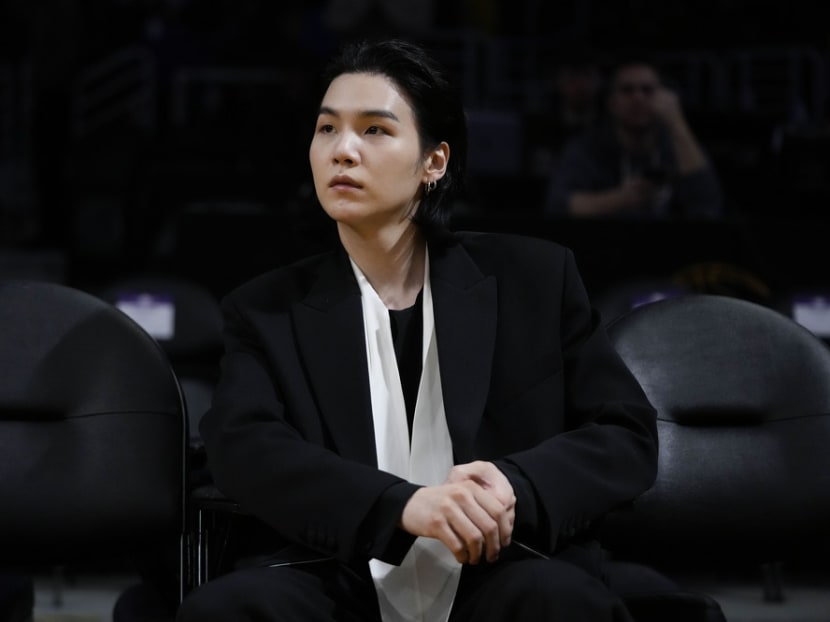 K-pop star Suga becomes third BTS member to begin military service in South Korea