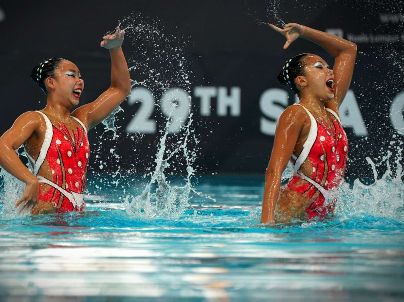 Singapore's Miya Yong (left) and Debbie Soh scored 75.1791 to beat the Malaysians to gold. Photo: Jason Quah/TODAY