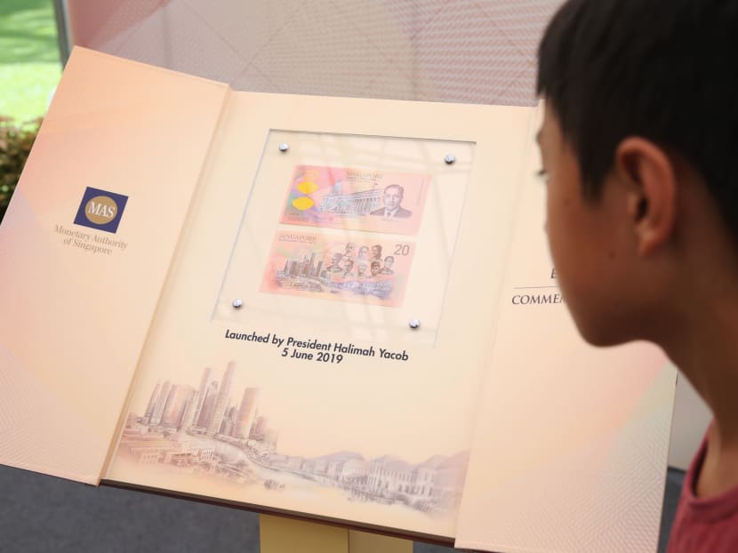 A boy looks at the Singapore Bicentennial commemorative note that was launched by President Halimah Yacob at the Istana Open House, June 5, 2019.
