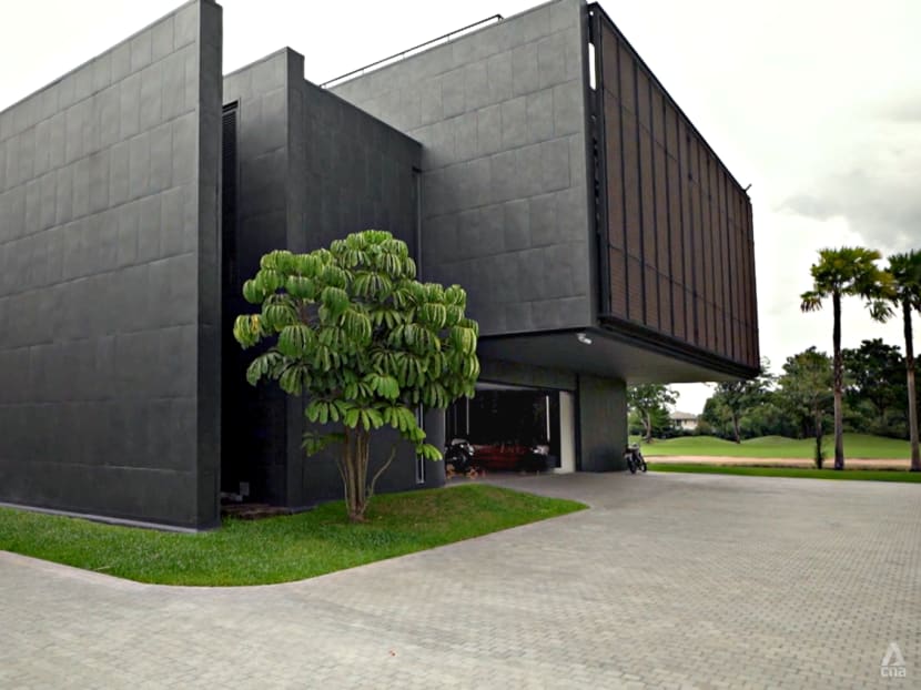 A structure built to look like an impenetrable bunker is actually home to a multigenerational Thai family