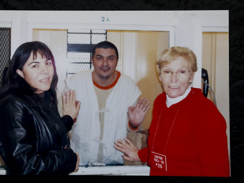 In this undated photo courtesy of Lidia Guerrero, she and her daughter Ada Saldano pose with her son Victor while he's on death row at the Polunsky Unit of the Texas Department of Criminal Justice, near Houston, Texas. Photo: AP