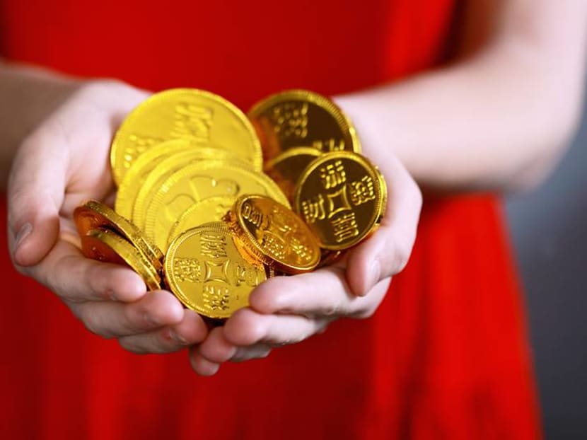 Commentary: Don’t stash your child’s hongbao money in the bank. Give them a chance to spend it