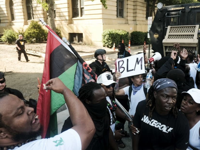 Sheriff officers snats in riot gear as demonstrators gather outside Akron City Hall to protest the killing of Jayland Walker, shot by police, in Akron, Ohio, July 3, 2022. Sheriff officers snats in riot gear as demonstrators gather outside Akron City Hall to protest the killing of Jayland Walker, shot by police, in Akron, Ohio, July 3, 2022.