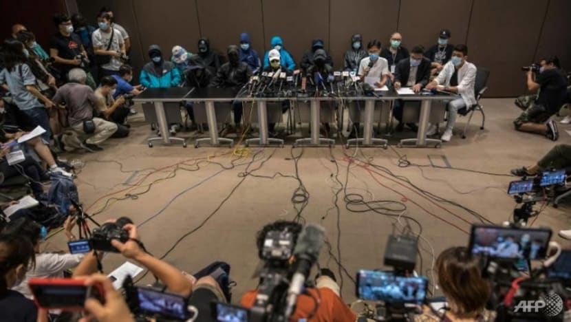 Democratic Hong Kong lawmakers stage brief protest in legislature against China arrests Democratic Hong Kong lawmakers stage brief protest in legislature against China arrests