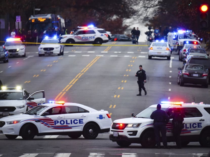 Police secure the scene where a shooter was present at Comet Pingpong on Connecticut Ave in Washington, DC.  Connecticut Ave near Comet Pingpong in Chevy Chase. Photo: The Washington Post via AP
