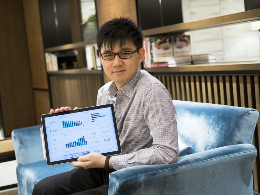 Mr Liu Lung Hao with a dashboard he created for clients to analyse their revenue and sales record so they can plan their future sales and marketing strategy. He is only 24, and already the boss of his own tech consulting firm, Feezmodo Consulting. Photo: Nuria Ling/TODAY