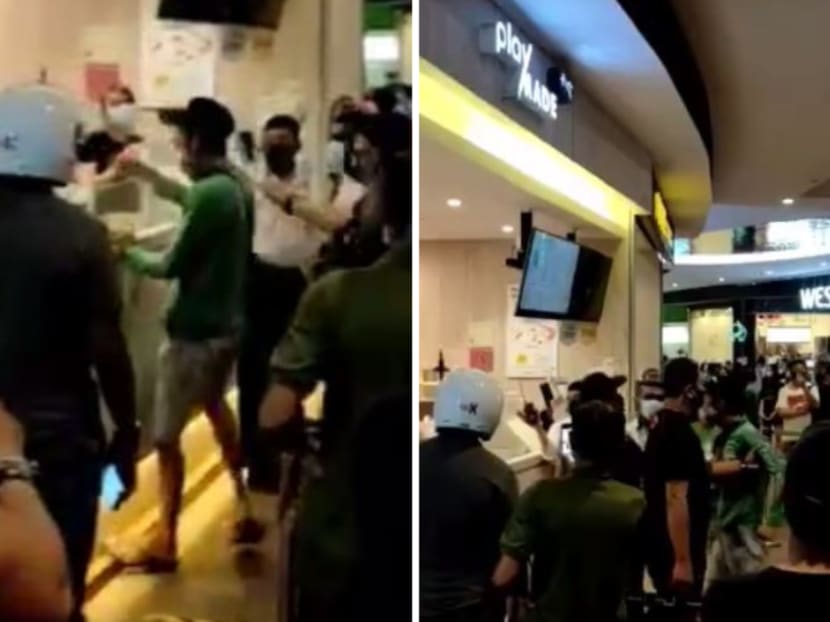 A video circulating online allegedly of the incident shows a man wearing a green GrabFood shirt shouting at employees of the Playmade outlet at Waterway Point. A video circulating online allegedly of the incident shows a man wearing a green GrabFood shirt shouting at employees of the Playmade outlet at Waterway Point.