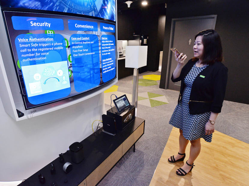 A StarHub staff demonstrating the use of smart home technologies at StarHub's Hubtricity Innovation Centre and Converged Operations on March 17, 2017. Photo: Robin Choo/TODAY