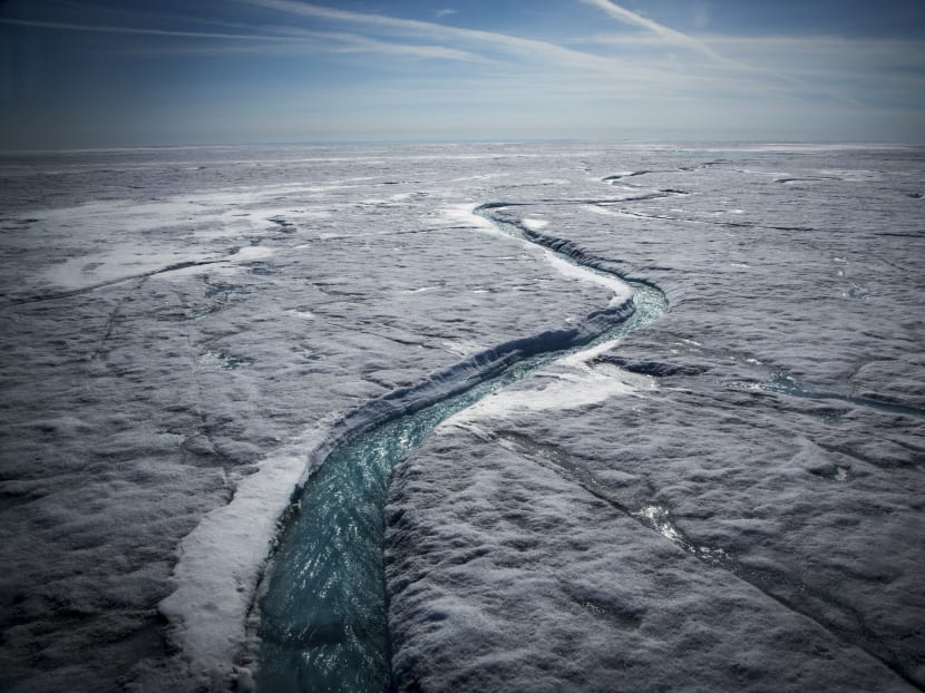 Meltwater flows along a supraglacial river on the Greenland ice sheet, July 19, 2015. Photo: The New York Times