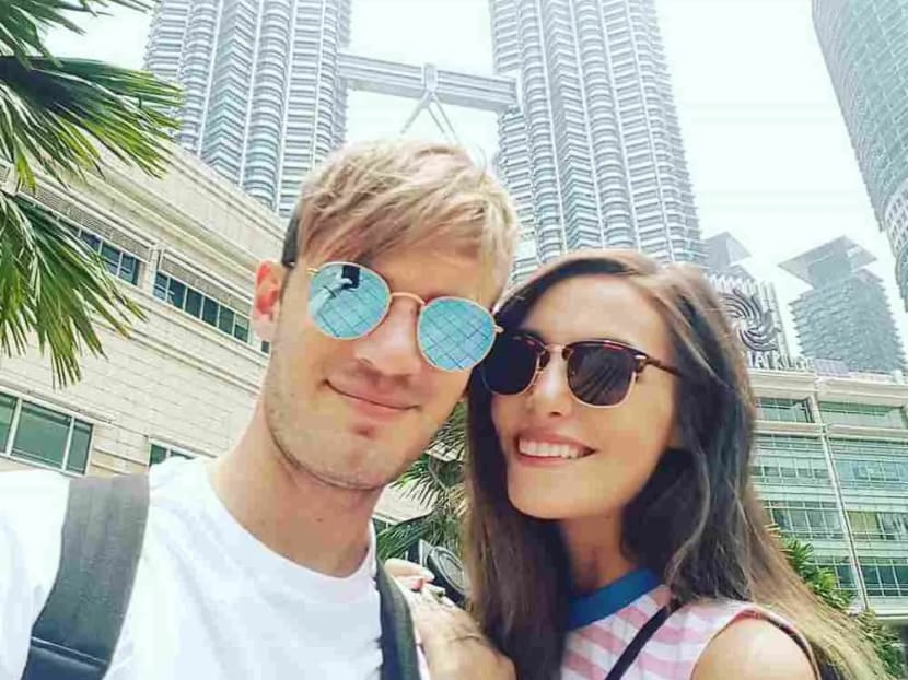 Swedish YouTuber Felix Arvid Ulf Kjellberg — also known as Pewdiepie — and his wife Marzia Bisognin pose for a photo while visiting Malaysia in 2016.