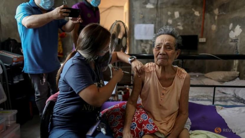 Philippine health workers bring COVID-19 vaccines to people unable to leave their house Philippine health workers bring COVID-19 vaccines to people unable to leave their house