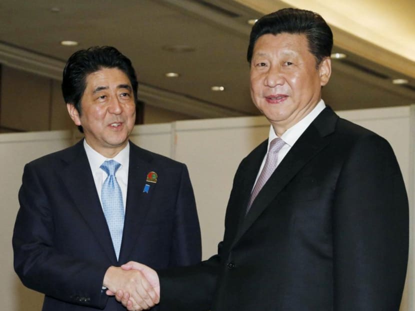 Gallery: Xi, Abe’s first meeting in five months signals thaw in ties