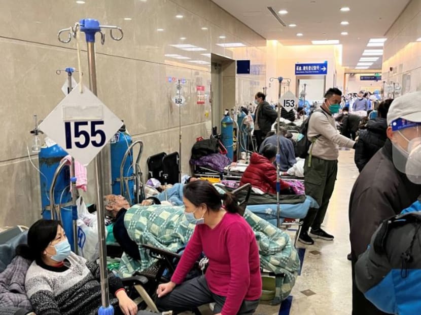 Patients lie on beds in a hallway in the emergency department of Zhongshan Hospital, amid the coronavirus disease (Covid-19) outbreak in Shanghai, China Jan 3, 2023. 