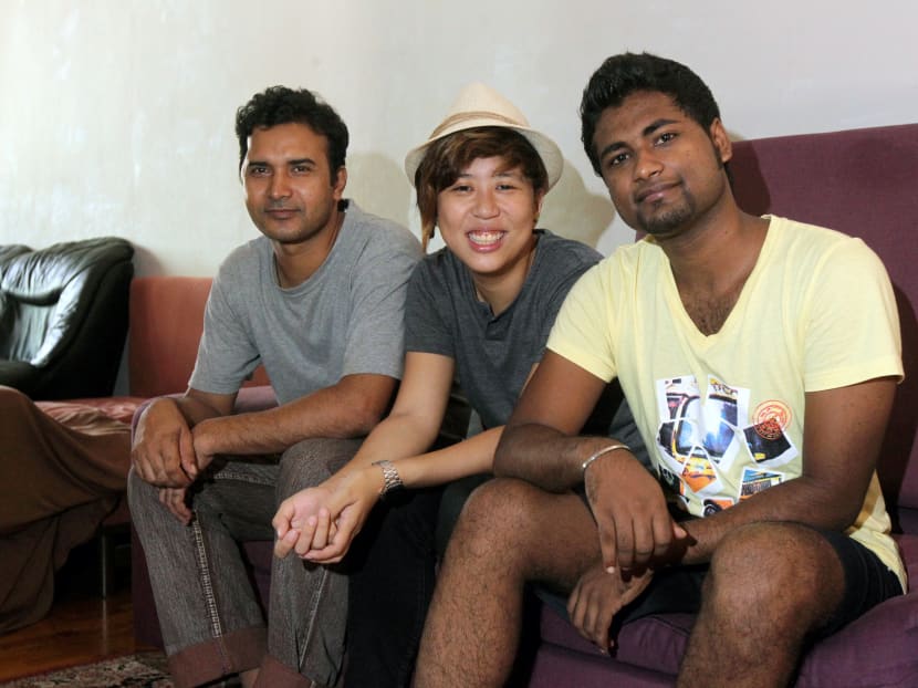 Photographer Bernice Wong with migrant workers at a soup kitchen in Little India. Photo: Ooi Boon Keong