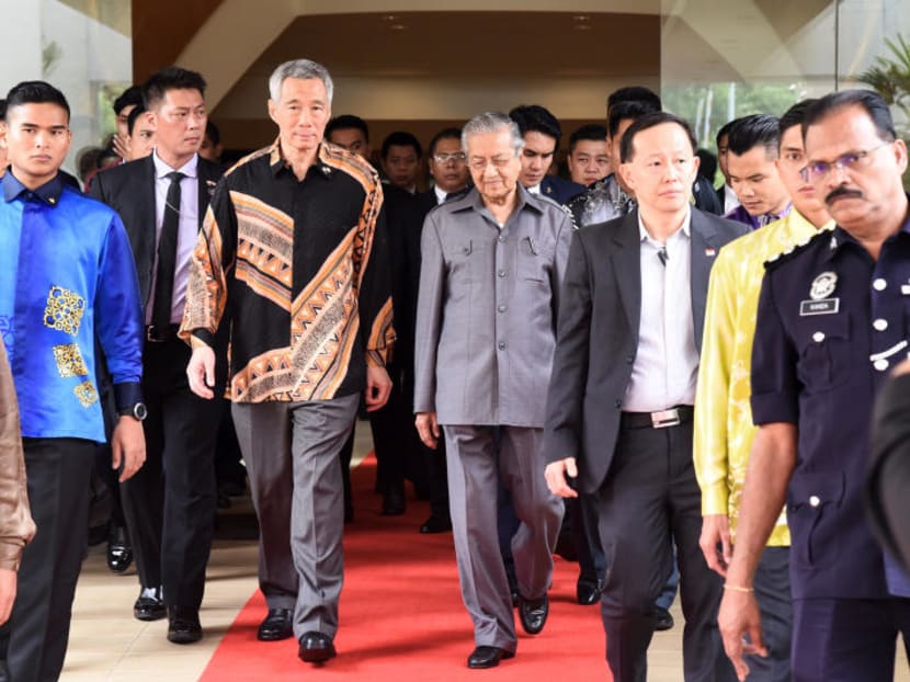 Singapore's Prime Minister Lee Hsien Loong (left) walks with his Malaysian counterpart Mahathir Mohamad after a meeting at Putrajaya on May 19. Mahathir's decision to pull the plug on the HSR had some fearing that bilateral relations between the two countries could regress.