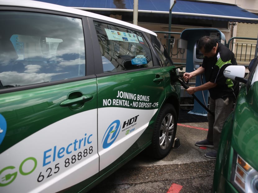 A driver of an electric taxi charging his car at the BYD Charging Station along Jalan Pemimpin in Marymount on Feb 19, 2020.
