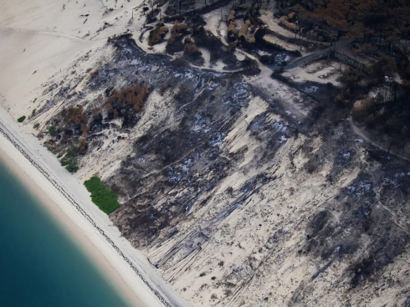 This aerial view taken on July 29, 2022 shows burnt forest area after wildfires, near La Teste-de-Buch, southwestern France. This aerial view taken on July 29, 2022 shows burnt forest area after wildfires, near La Teste-de-Buch, southwestern France.