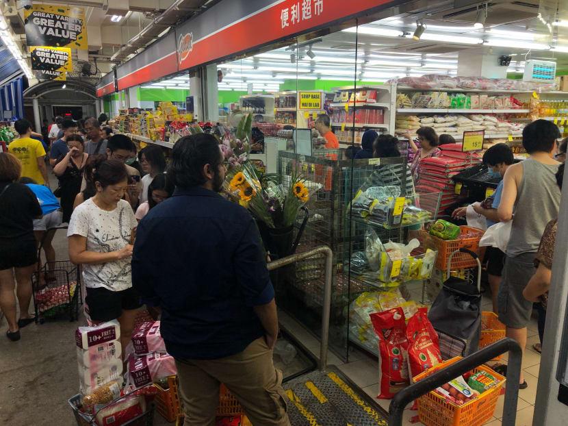 Singaporeans rush to supermarkets after Malaysia announces lockdown, but no widespread excessive buying