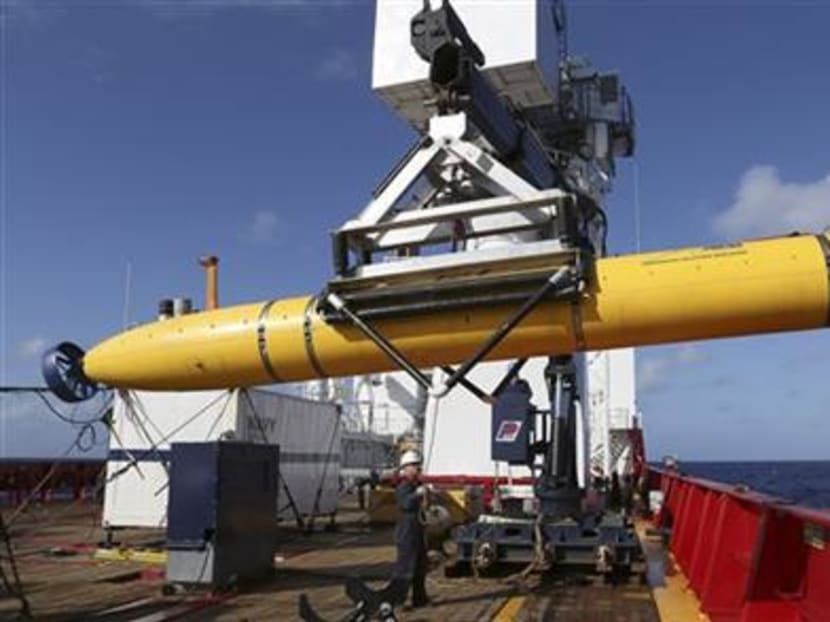 In this April 17, 2014 photo provided by the Australian Defence Force the Phoenix International Autonomous Underwater Vehicle (AUV) Artemis is craned over the side of Australian Defence Vessel Ocean Shield before launching the vehicle into the southern Indian Ocean in the search of the missing Malaysia Airlines Flight 370. Photo: AP