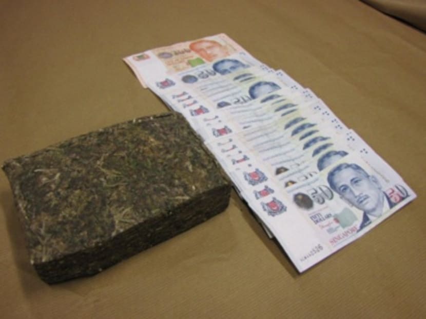 Cannabis and cash seized in a Central Narcotics Bureau (CNB) operation at Ang Mo Kio on Feb 12, 2014. Photo: CNB