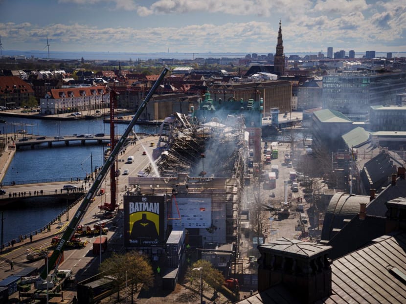 Firefighters work on putting out the still-smouldering blaze at the Boersen, Copenhagen's Old Stock Exchange in Denmark on April 17, 2024.