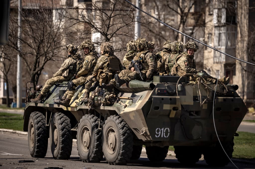Ukrainian soldiers sit on an armoured military vehicle in the city of Severodonetsk, Donbas region, on April 7, 2022, amid Russia's military invasion launched on Ukraine. Ukrainian soldiers sit on an armoured military vehicle in the city of Severodonetsk, Donbas region, on April 7, 2022, amid Russia's military invasion launched on Ukraine.