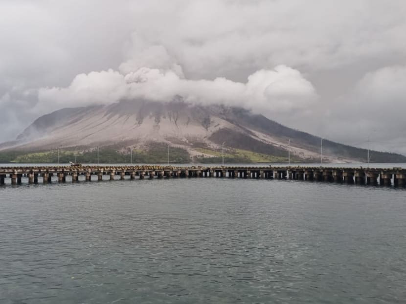 A handout photo taken and released by Center for Volcanology and Geological Hazard Mitigation on April 18, 2024 shows Mount Ruang spewing smoke in Sitaro, North Sulawesi. 