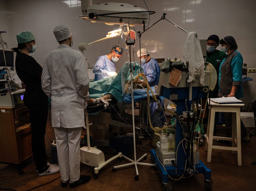 Doctors try to save the arm of a Ukrainian soldier who was wounded by Russian shelling in Zaporizhzhia on April 25, 2022. Months of Russian artillery, airstrikes and rocket attacks have overwhelmed the hospitals of Eastern Ukraine, which are operating on skeleton crews or have been abandoned completely. Doctors try to save the arm of a Ukrainian soldier who was wounded by Russian shelling in Zaporizhzhia on April 25, 2022. Months of Russian artillery, airstrikes and rocket attacks have overwhelmed the hospitals of Eastern Ukraine, which are operating on skeleton crews or have been abandoned completely.