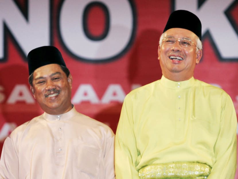 Mr Najib (right) and Mr Muhyiddin in happier times at an UMNO event in 2009. Mr Muhyiddin’s attack on the Prime Minister at an event on Sunday night was the straw that broke the camel’s back. Photo: REUTERS