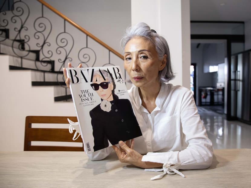 Mdm Ong Bee Yan with the latest issue of Harper's Bazaar Singapore, whose cover she graces.
