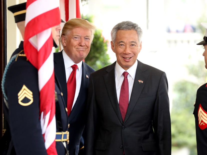 United States President Donald Trump greeting Prime Minister Lee Hsien Loong as he arrives at the White House in Washington on Monday (Oct 23). Photo: Reuters