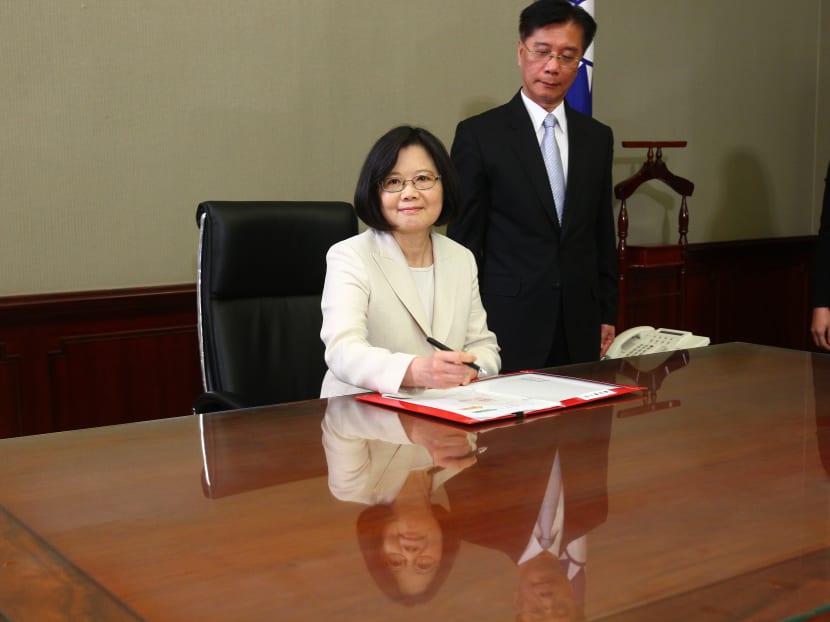 Taiwan's President Tsai Ing-wen signs her first document at her new desk following the inauguration ceremony at the Presidential Office in Taipei, Taiwan May 20, 2016. Taiwan inaugurated Tsai as its first female president on Friday, returning the pro-independence Democratic Progressive Party to power amid new concerns over increasingly fractious relations with Beijing and a flagging economy. Photo: Taipei Photojournalists Association/Pool Photo via AP