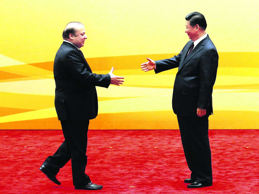 China's President Xi Jinping (R) shakes hands with Pakistan's Prime Minister Nawaz Sharif at a meeting in Beijing last year. Reuters file photo
