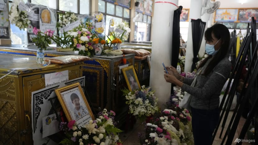Grieving families pray at Thai temple for slain nursery victims