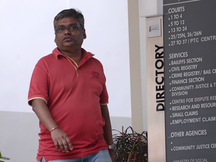 Former RSAF engineer Rajkumar Padmanthan was one of three men charged with a total of 352 counts of cheating, corruption, and violating the Official Secrets Act at the State Courts on July 21, 2017. Another engineer and contractor were charged too. Photo: Robin Choo/ TODAY