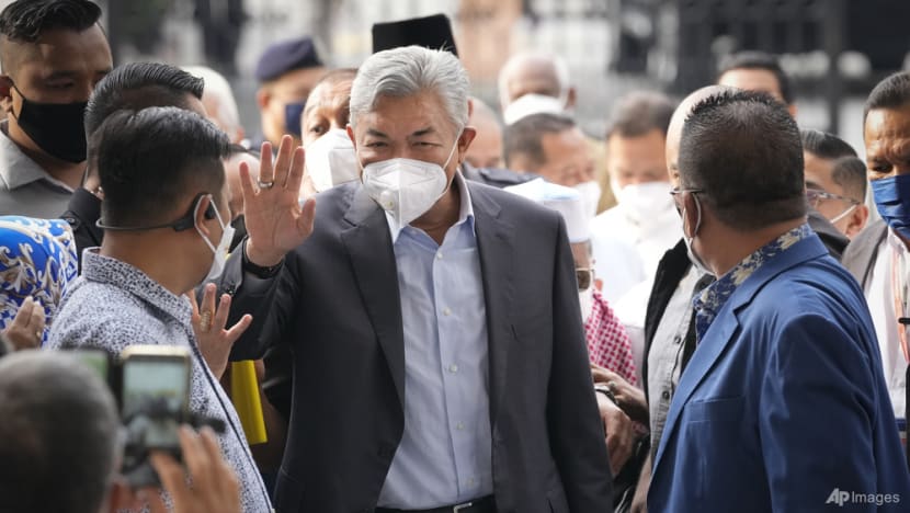 UMNO president Ahmad Zahid ordered to enter defence on corruption, money laundering charges UMNO president Ahmad Zahid ordered to enter defence on corruption, money laundering charges