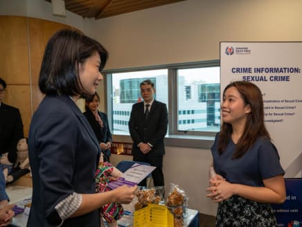 Minister of State Sun Xueling (left) speaking to Ms Charmaine Foo Wen Ning, a victim care officer and student in the psychology (forensic psychology) programme of the Singapore University of Social Sciences on April 15, 2024.
