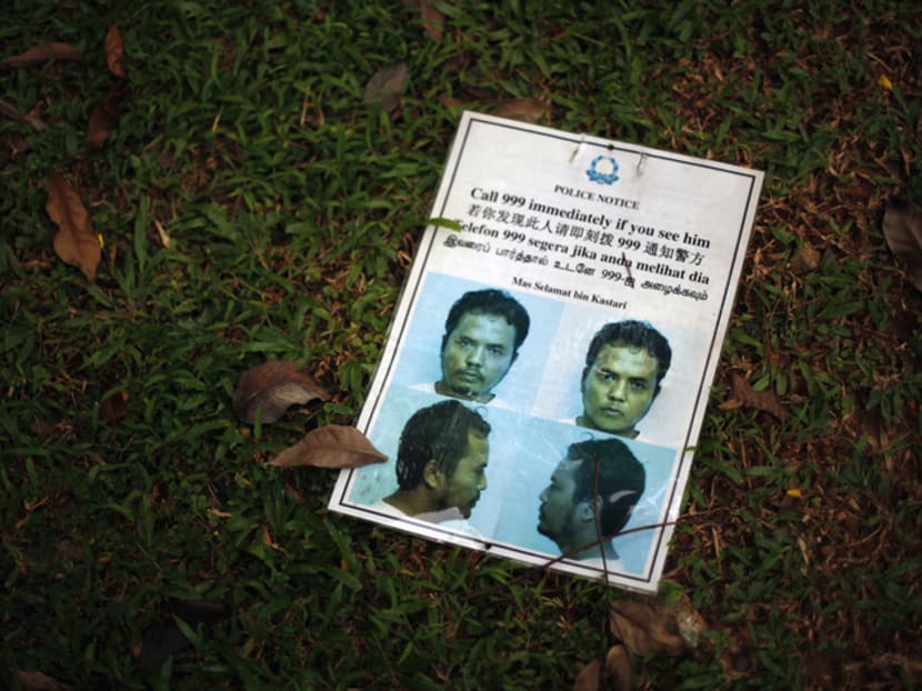 A worn-out poster of Mas Selamat Kastari is pictured at a park in Singapore in 2008. He is one of four Jemaah Islamiyah members still detained under the Internal Security Act.