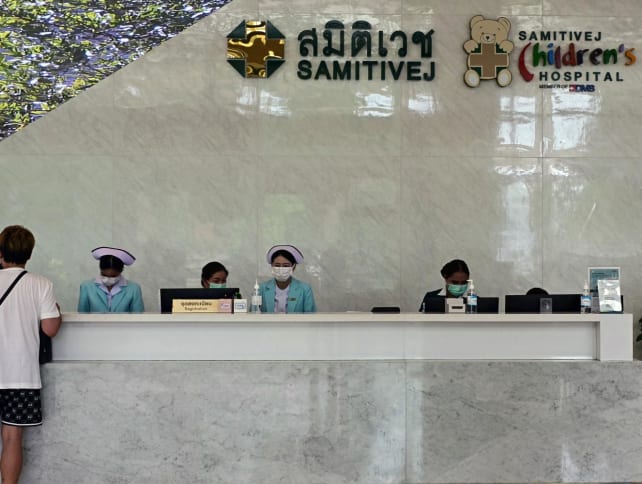 Hospital personnel work on a registration desk at Samitivej Srinakarin Hospital in Bangkok on May 22, 2024. 