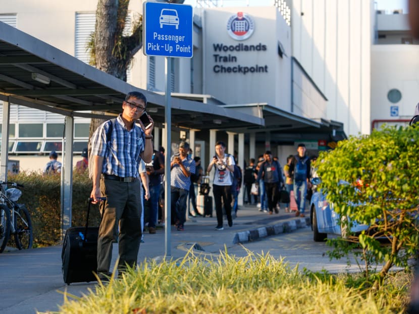 Malaysians returning home from Singapore on March 17, 2020. A number of Malaysians have remained in Singapore, but some have found themselves out of work.