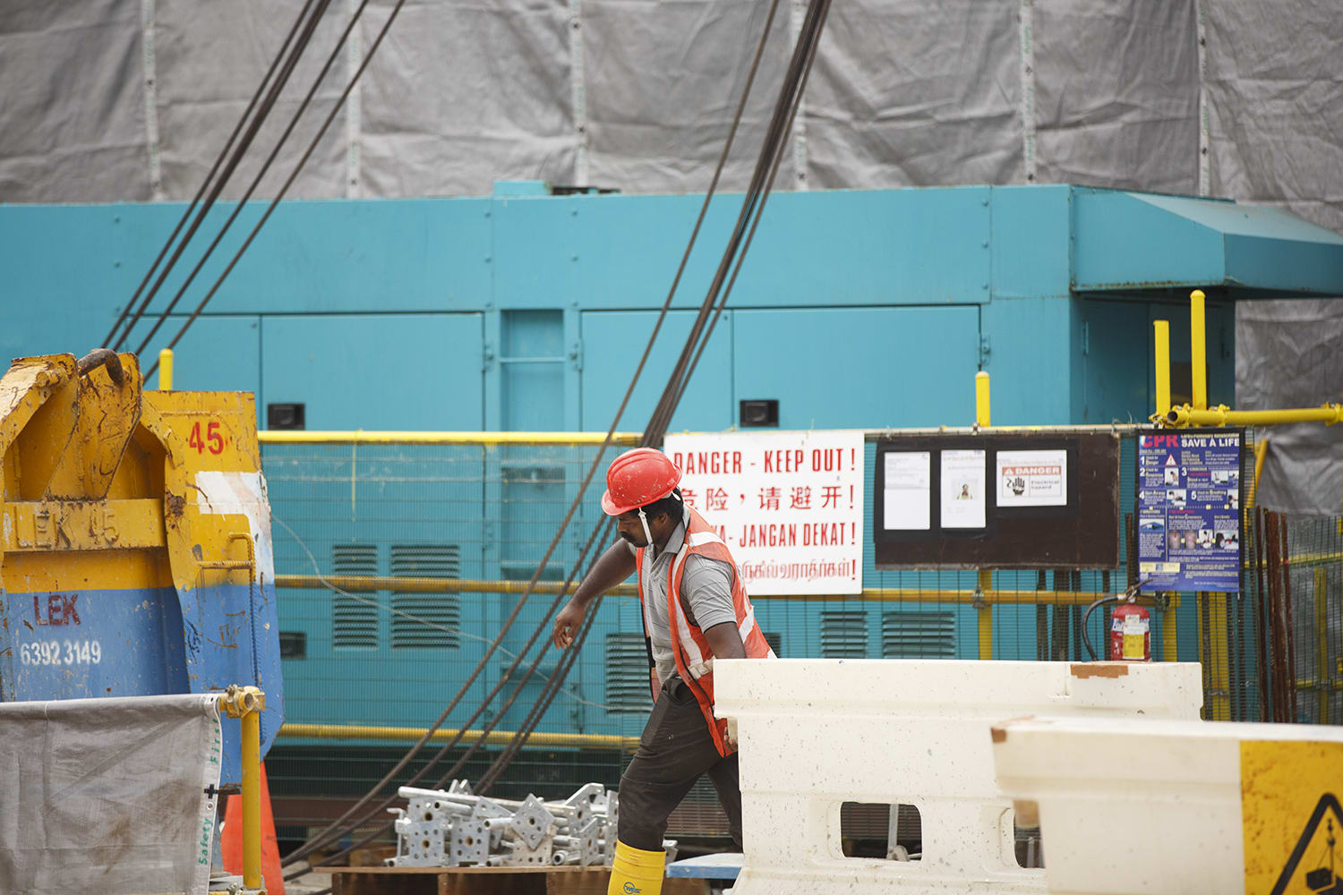A worker at a construction site along North Bridge Road on May 13, 2022. A worker at a construction site along North Bridge Road on May 13, 2022.