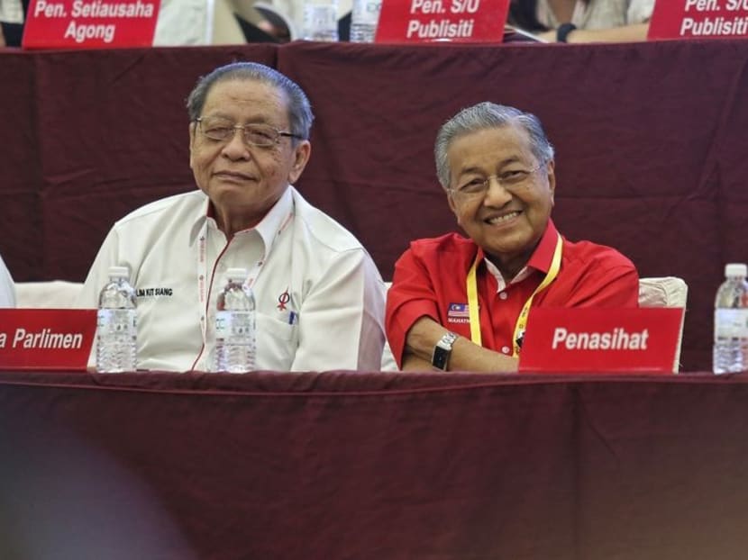 Former prime minister Tun Dr Mahathir Mohamad (R) is pictured sitting next to DAP veteran leader Lim Kit Siang at the DAP National Conference 2016 in Shah Alam, Dec 4, 2016. Photo: Malay Mail Online