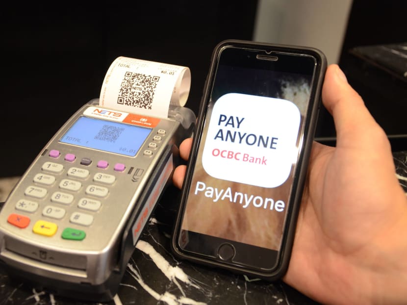 The OCBC Pay Anyone app is available for download on the Apple and Google Play mobile app stores. With the app, customers can simply scan QR codes at participating merchants’ NETS terminals to pay for their purchases directly from their OCBC Bank account. Photo: OCBC